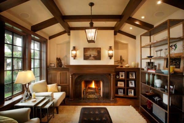 build a cozy living room library in a tudor style house interior featuring exposed wood