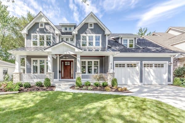 pair wood front door with james hardie’s night gray for an elegant blue-gray house