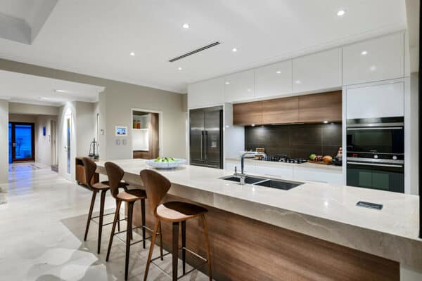 evoke a sophisticated and comfortable mood for a galley kitchen with an oak island and tile backsplash