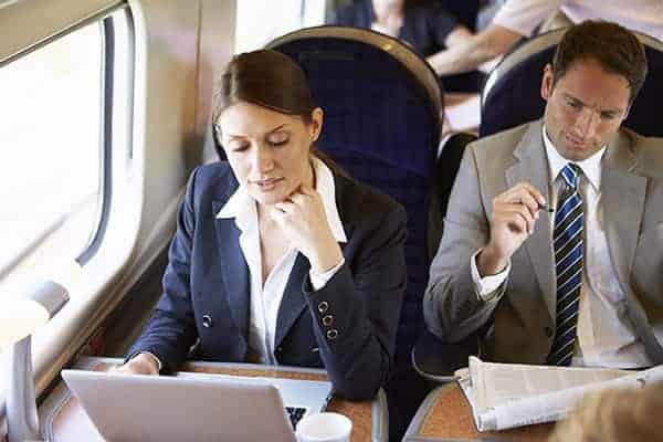 business people working on a train