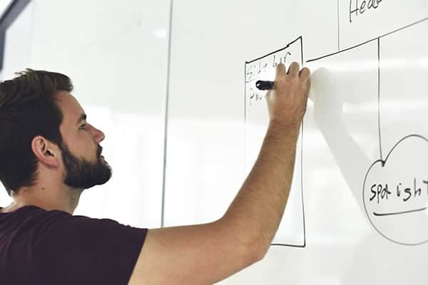 Man writing on whiteboard