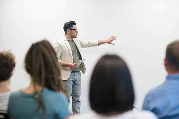 Male speaker presenting at networking event