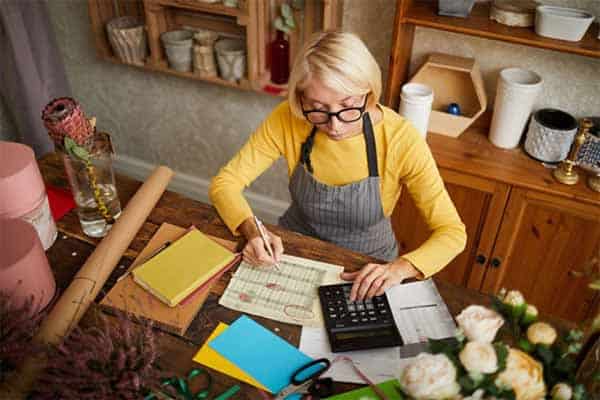 A small business owner calculating her taxes.