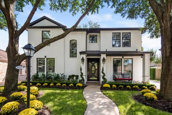 contemporary classic white house finished with modern black windows