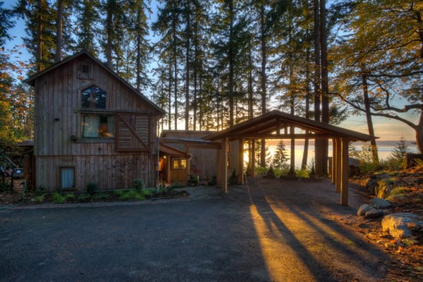 try a rustic carport with wooden posts and a roof to make room for a stunning surrounding landscape