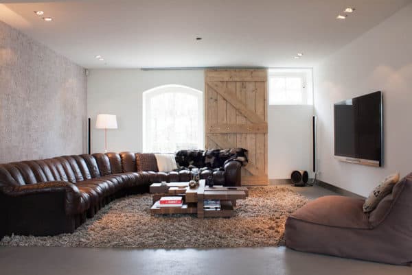 large barn door as the window shutters to blend historic and modern features for a comfy living space