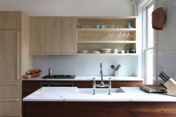 go for a galley kitchen with light brown cabinets and farmhouse styled sink