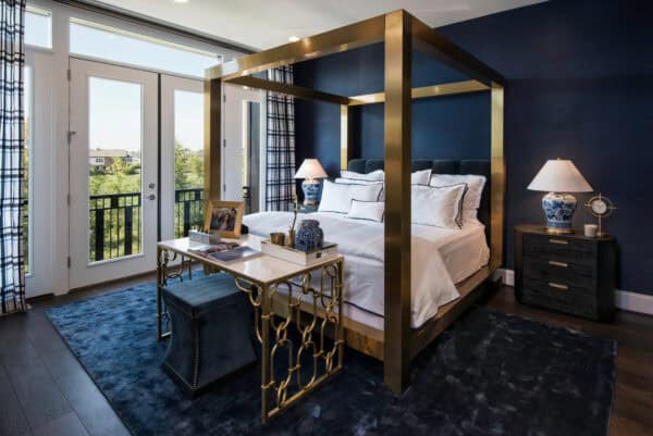 accentuate your royal blue bedroom with striking gold features for a lavish and plush effect