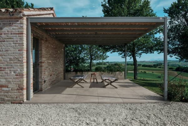 contrast a simple pergola with a minimalist front porch tile with brick siding for a dynamic look