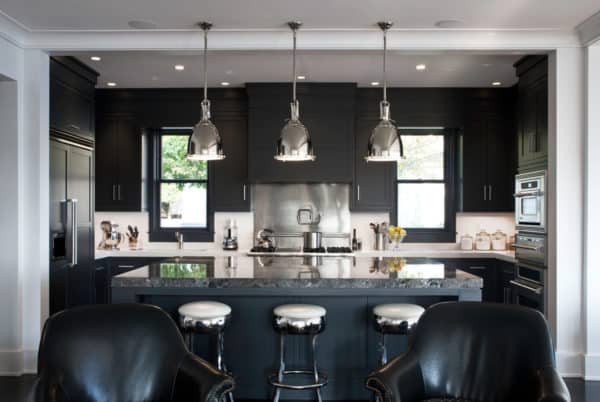 evoke some drama with black furniture contrasting white walls and stainless appliances