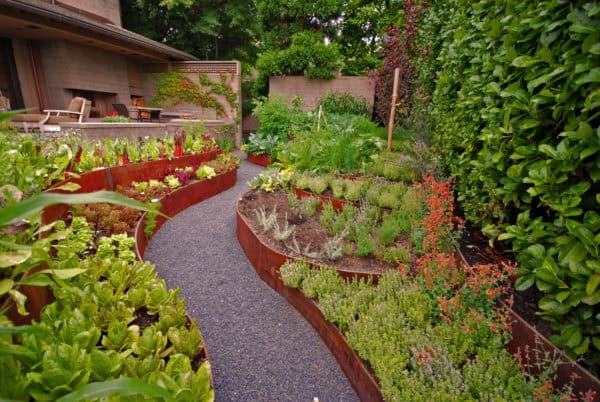 build a green thumb's paradise with some retaining walls made from corten steel planters