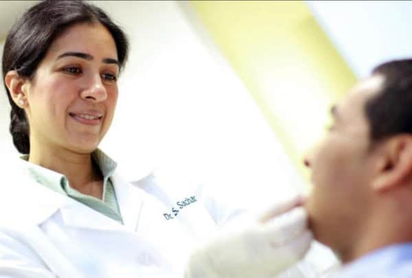 NYC Dentist - Dr Sachar with a patient Dentist NYC Dr Sachar with a patient
