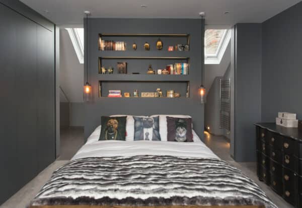 incorporate built-in shelves on your false bedroom wall for elegant storage and display