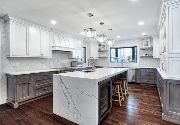 use eye-catching pendant lights and houseplants to complement the kitchen bay window over sink