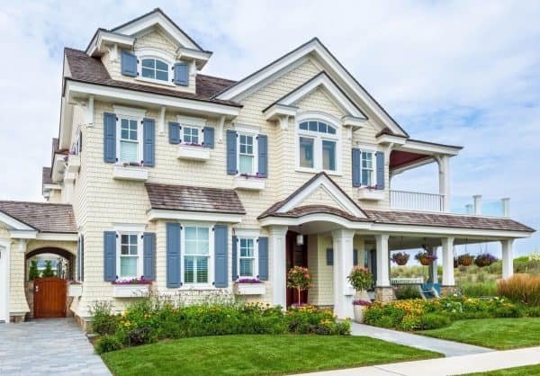 try a charming yellow house with maibec cedar shake siding and atlantic premium blue shutters