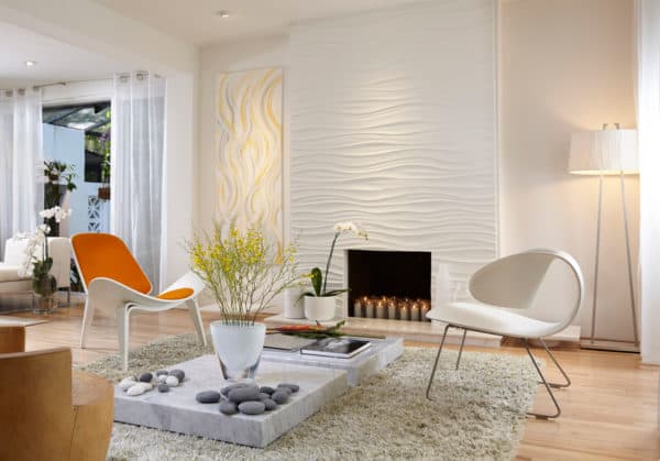 elevated marble tile in front of fireplace in a bright and airy living room