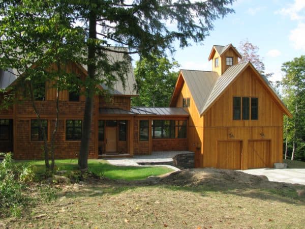 create a charming rustic vibe for your detached garage and breezeway with wood exterior and metal roof