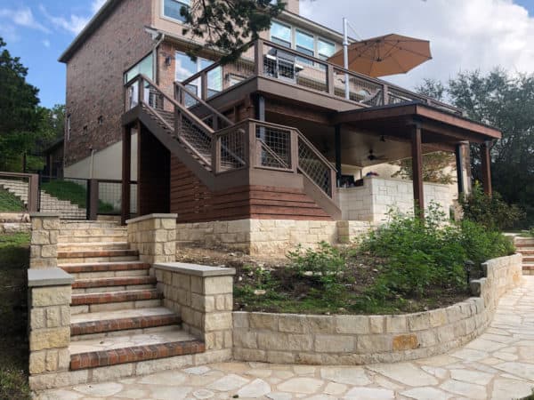 an eclectic second-story deck embodies the best of outdoor living with mixed material railing