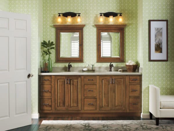 install brown cabinetry to complete this gorgeous bathroom with patterned green walls