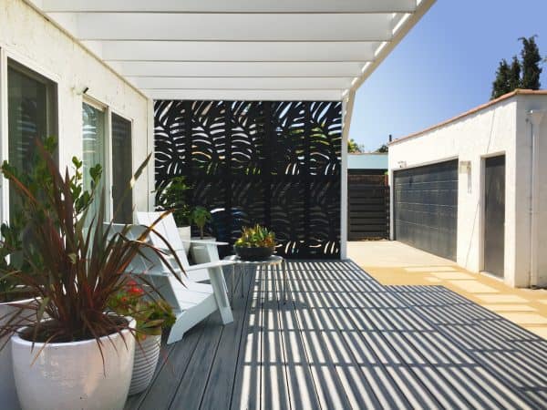 a redwood pergola and screen wall will transform any small backyard into a nifty space with no grass