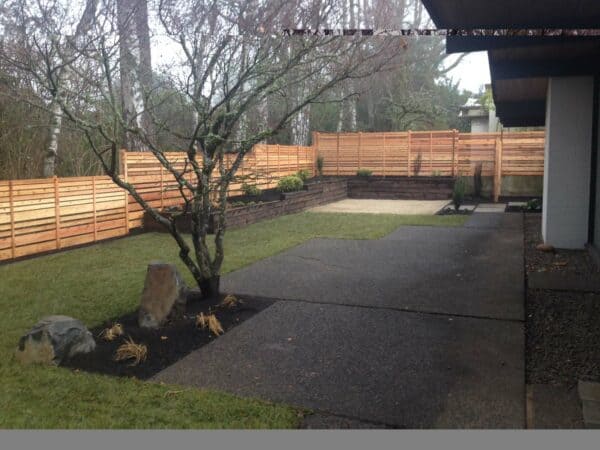 play with height through your cedar fence on the juniper wood retaining wall for a unique and artistic charm