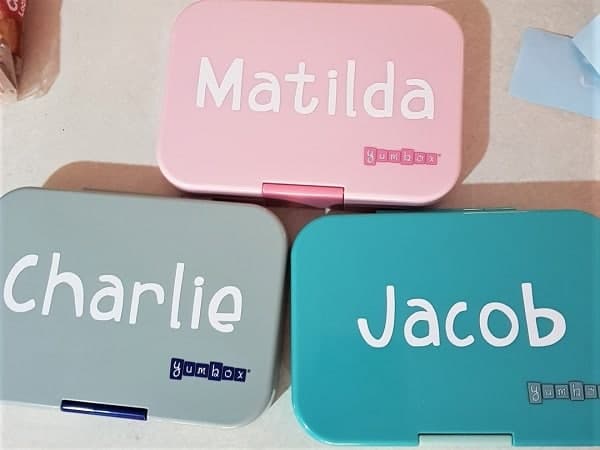 Lunchboxes labelled ready to go back to school.