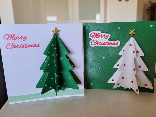 Two of my finished Christmas tree pop-out cards on display. Both are quite different.