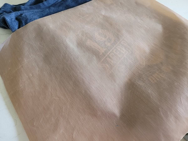 Teflon sheet to add more heat on a HTV garment after the carrier sheet has been removed