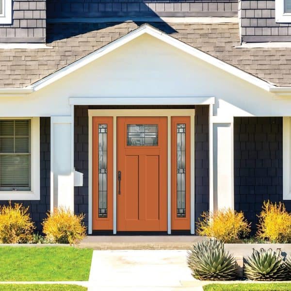 this therma-tru orange front door features unique glass panels to evoke an artistic look