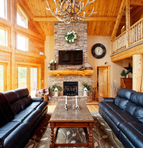 maximize natural light to enhance the light wood elements in this modern log cabin living room