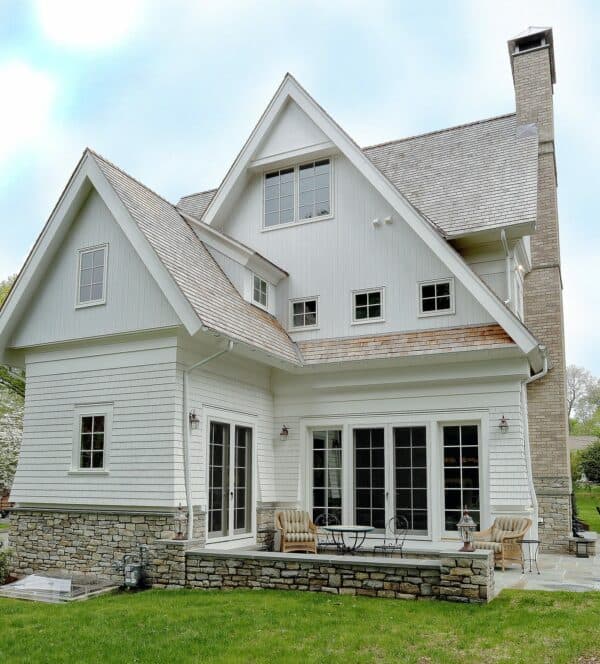 pair vertical cedar v-groove siding with red cedar shakes roof for an elegant wood exterior