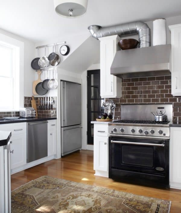 create an industrial and modern kitchen by combining brown floor and white walls