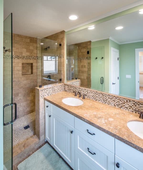 build a bright beach style master bathroom with brown tiles and beautiful green walls