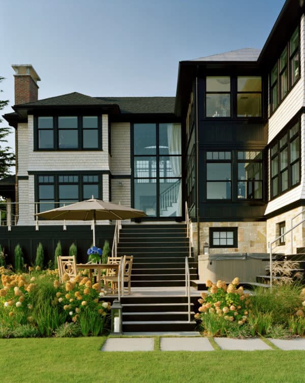 victorian dark wood windows in a lovely white cedar house