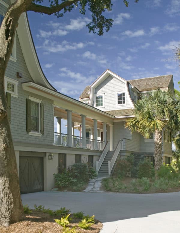 cover the breezeway and use grand pillars for a victorian style home exterior