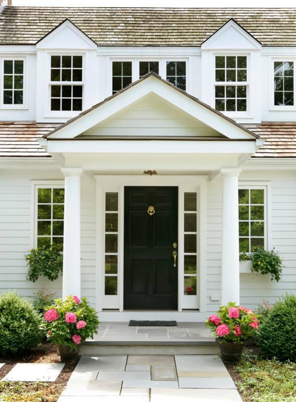 traditional roof over door entry with tuscan columns for a strong suburban curb appeal