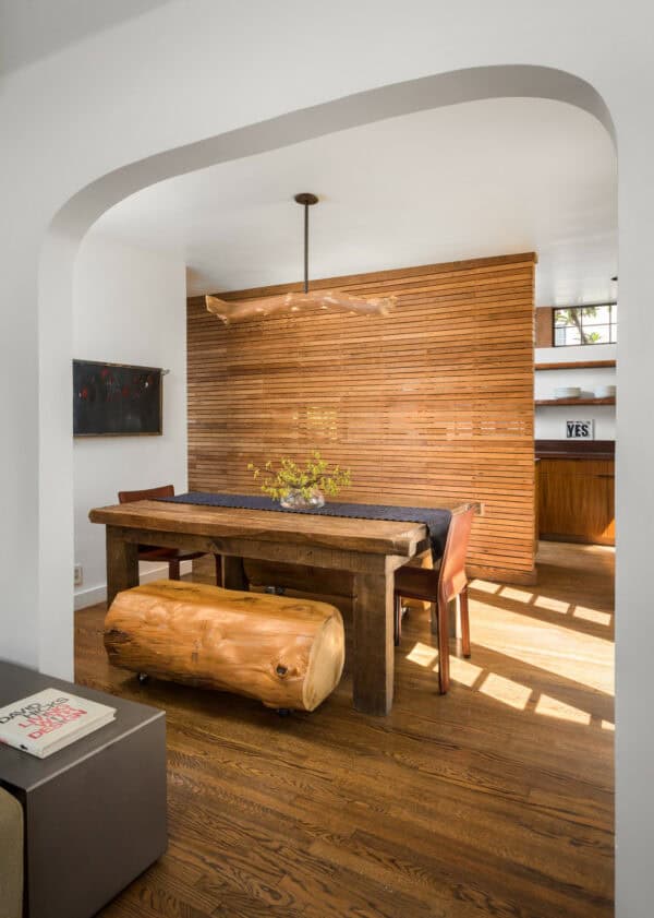 get creative with various log wood features and a rustic false wall for a charming dining room