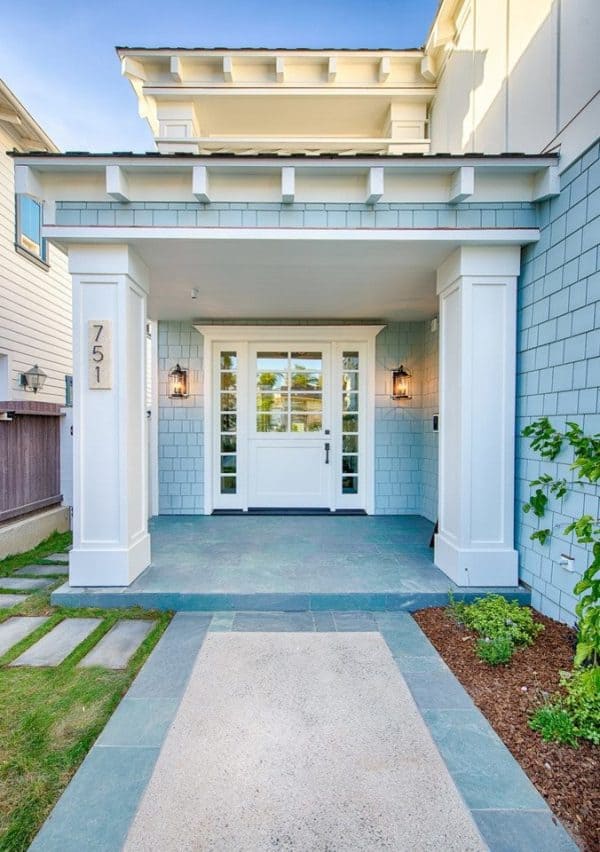 try a white front dutch door that enhances the blue surfside exterior and cool stone porch