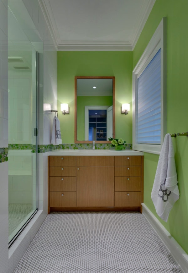 try using light green walls to complement light brown cabinet for a modern bathroom