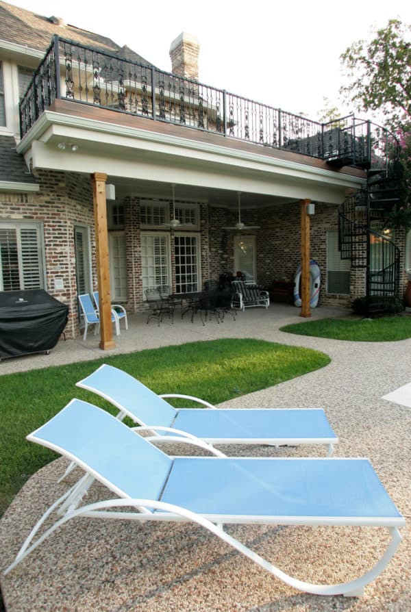 turn roof extension into an attractive second-story deck with traditional features and intricate railing