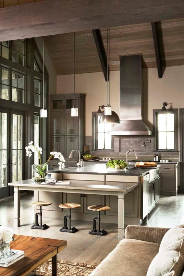 lavish residence showcases opulence through these grey-stained cabinets and open floor plan