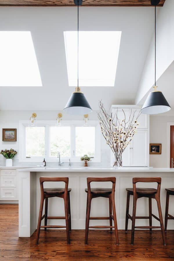 brown accents can be exquisite for a kitchen featuring white cabinets with white countertops