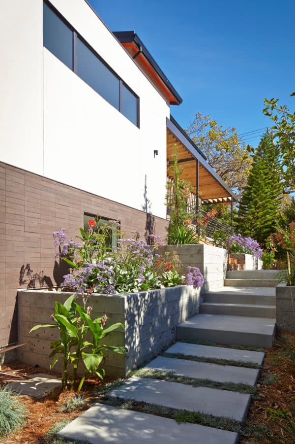 create a comfortable modern villa design with large concrete front steps