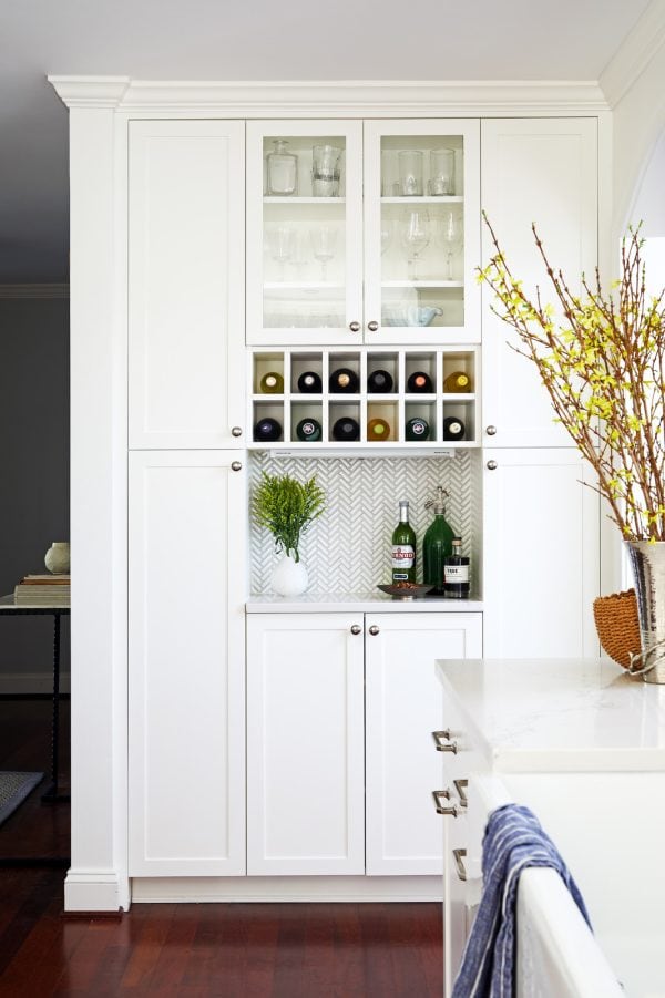 create a beachside sanctuary featuring this small wet bar idea with wine rack and mosaic backsplash