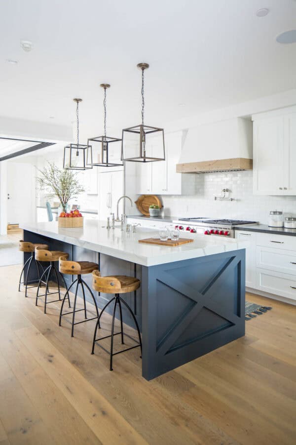 go for a modern farmhouse vibe in a galley kitchen with sherwin williams’ waterloo island and wooden bar stools