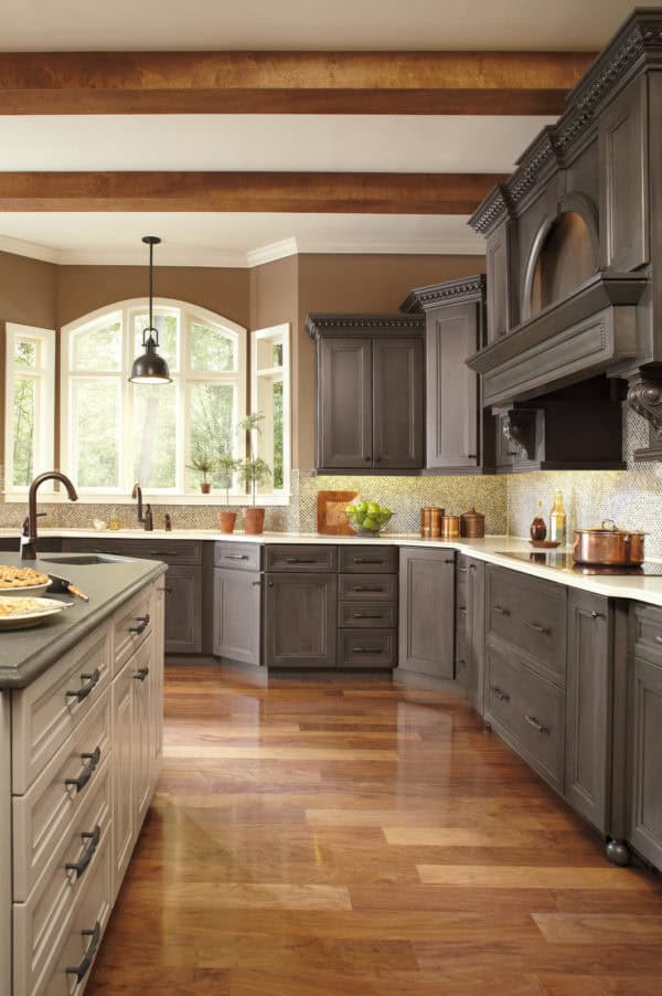 install colorful backsplash behind grey-stained kitchen cabinets for a beautiful traditional vibe