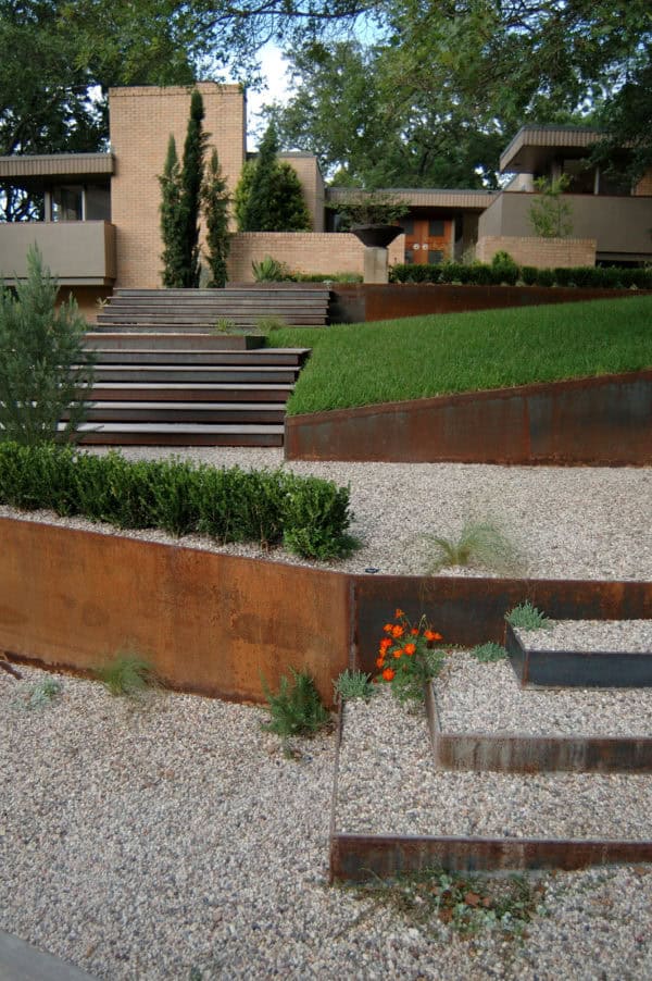 try a contemporary corten steel retaining wall landscape with dynamic step design and gravel