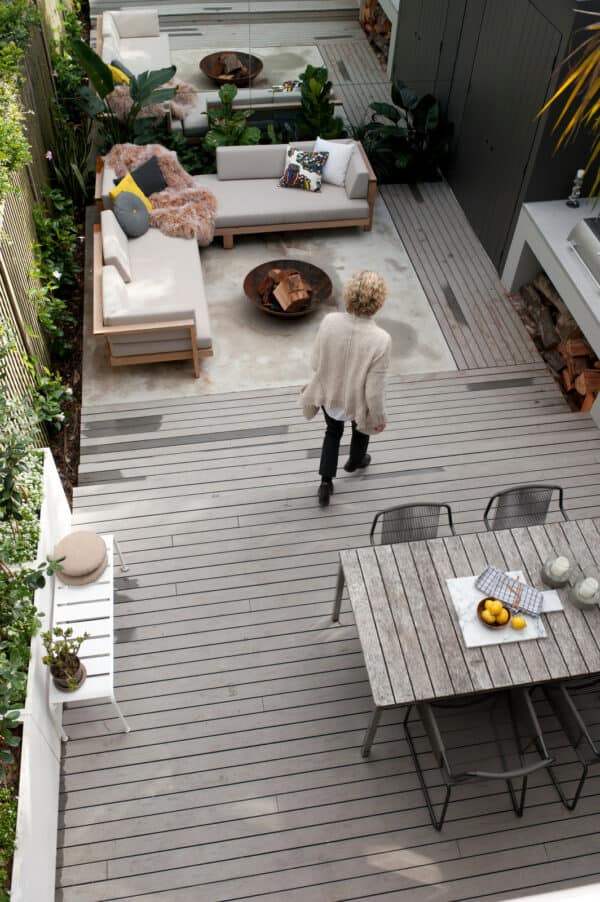 combine concrete and modwood for a modern small backyard deck with a cozy seating area