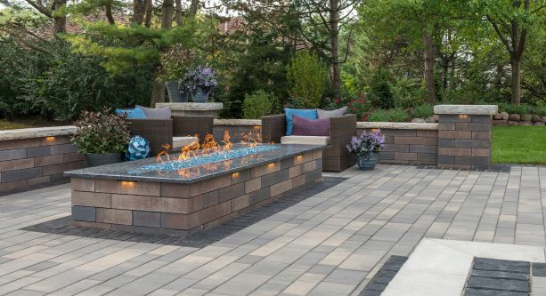 a simple and minimalist design patio with concrete paver and rectangular fire pit