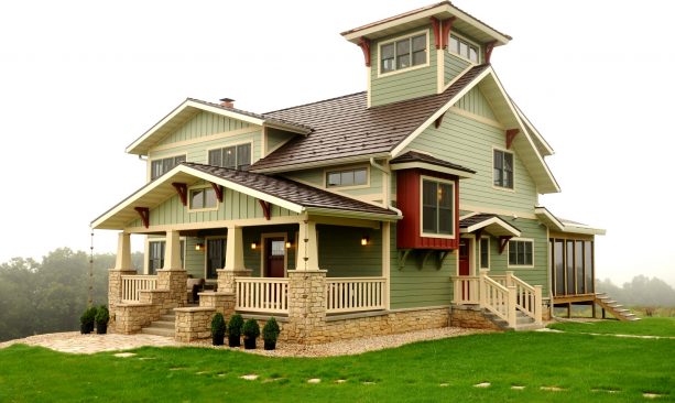 red accents in a sage green home exterior design